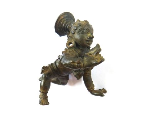 A bronze figure of bala Krishna, South Indian, probably 17th/18th century, the infant Krishna modelled crawling and holding a