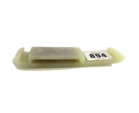 A Chinese white jade rectangular belt buckle, probably 19th century, carved in low relief with a sinuous dragon and a chilong