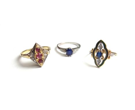 A platinum ring, claw set with an oval cut sapphire at the centre, between diamond set three stone shoulders, a gold and plat