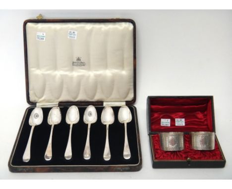 A set of six silver Old English pattern ice cream spoons, London 1930, with a case and a pair of Victorian silver napkin ring