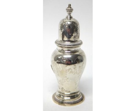 A silver sugar caster, of inverted pear shaped form, decorated with reeded borders, by R. Comyns, London 1965, weight 207gms.
