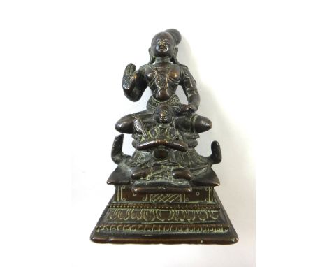 A bronze group of two Tamil saints, South India, 18th century, the diminutive figure in front probably Rama Nuja, 10cm.high.