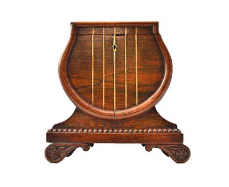 A Regency brass inlaid rosewood tea caddy of lyre shape, with secret caddy spoon drawer on scroll feet, 21cm wide.  Illustrat