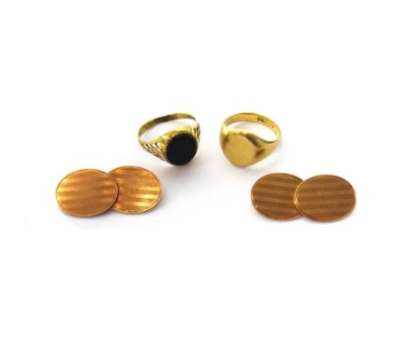 A pair of 9ct gold oval cufflinks, the backs and the fronts with banded decoration, Birmingham 1945, a 9ct gold oval signet r