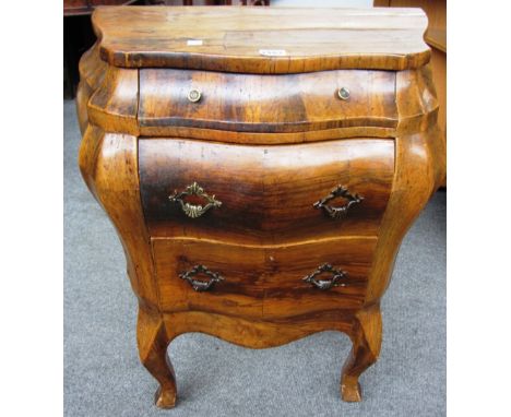 An 18th century style miniature olive wood bombe three drawer commode on cabriole supports, 61cm wide x 69cm high. 