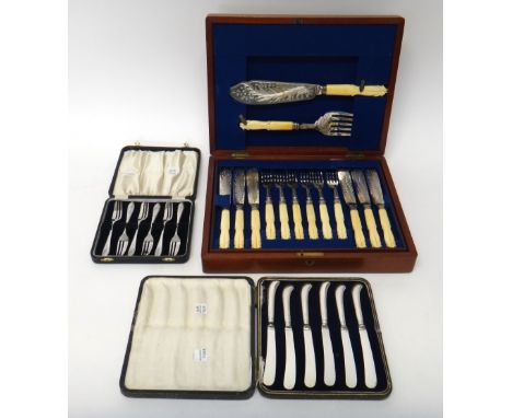 Six pairs of plated fish knives and forks with carved ivory handles and a matching pair of fish servers with carved ivory han