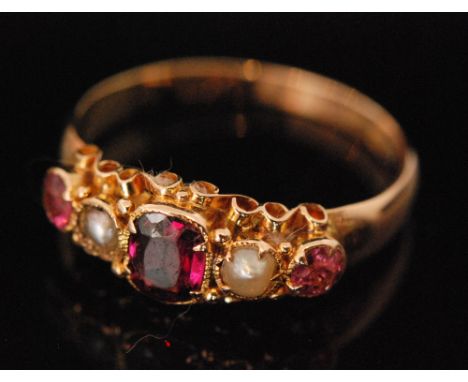 A Victorian 15ct hallmarked five stone almandine garnet and split pearl boat shaped ring, Birmingham 1864, ring size O.