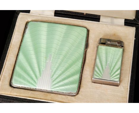 A cased Art Deco hallmarked silver cigarette case and matching lighter each detail with green and white enamelled decoration 