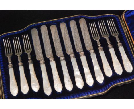 A Victorian hallmarked silver fruit set composed of six mother of pearl and silver foliate engraved fruit knives and forks co