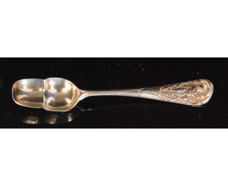 A Georgian silver caddy spoon with shell back acorn shaped bowl below tapering terminal with cast cherub cartouche to the fin