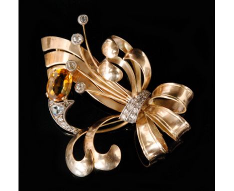 A mid 20th Century gold diamond and citrine spray brooch set with single citrene, four millegrain set diamonds above a diamon