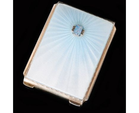 An Art Deco hallmarked silver compact with pale blue enamel sunburst decoration radiating from rectangular opal doublet to fr