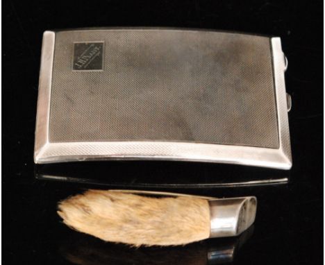 A George V hallmarked silver shaped rectangular cigarette case with engine turned decoration and engraved cartouche, weight 5