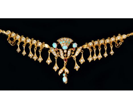 An Edwardian 9ct opal and seed pearl fringe necklet, central opal and pearl fan design flanked by further pearl set drops, al