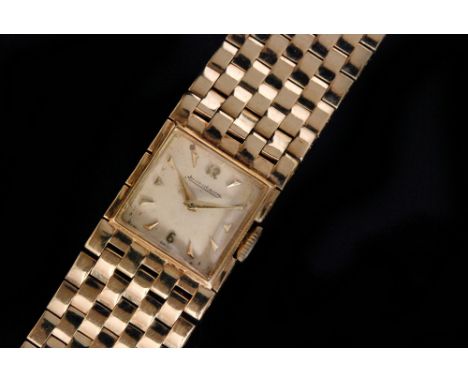 A 1950s 9ct Jaeger LeCoultre lady's manual wind wristwatch , square sivered dial with gilt metal dart markers, movement numbe