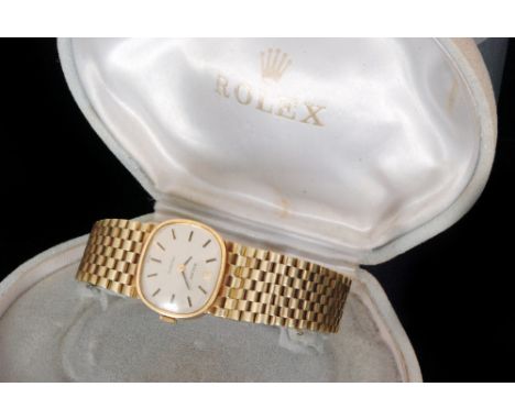 A 1970s 14ct Rolex manual wind lady's wristwatch, the shaped square face with silvered dial, black and gilt baton markers and