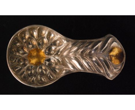 A contemporary white metal and gilt caddy spoon, the circular bowl embossed with pod shaped tendrils and centred by a gilt ci