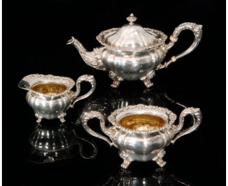 An early 20th Century American Sterling silver three piece tea service composed of teapot, sugar bowl and cream jug, pattern 