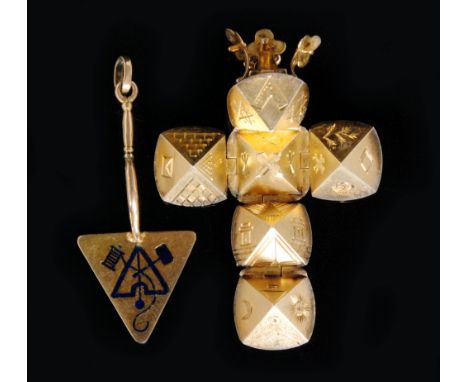 An early 20th Century 9ct Masonic pendant modelled as a trowel, detailed with blue enamel symbols, length 4cm, together with 