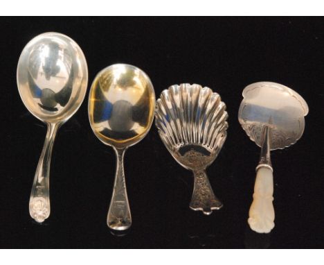 Four Victorian hallmarked silver caddy spoons to include a bright cut example with plain gilded oval bowl and foliate decorat