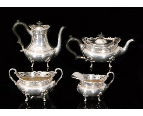 A hallmarked silver four piece bachelor's tea service composed of teapot, hot water pot, sugar bowl and cream jug, each of sq