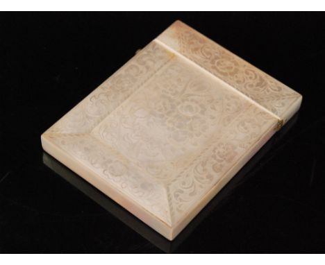 A late 19th Century rectangular mother of pearl card case with foliate engraved decoration to whole, length 10cm. 
