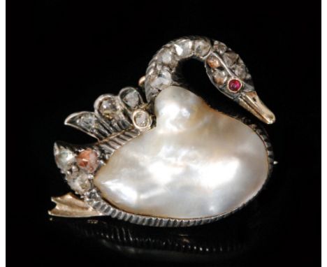 An early 20th Century blister pearl and diamond brooch modelled as a swan, pearl body below diamond set wings, neck and ruby 