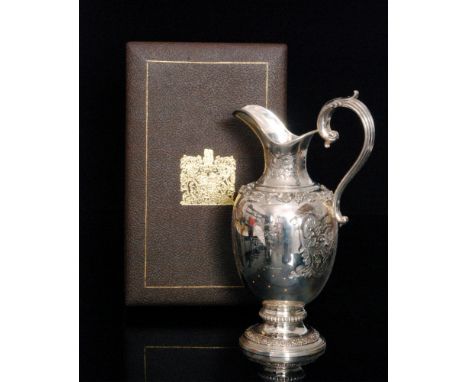 A Queen Elizabeth II Silver Wedding commemorative hallmarked silver claret jug of typical form with relief molded fruiting vi