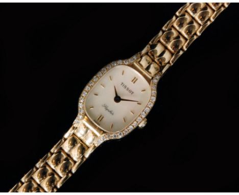 A 9ct and diamond lady's Tissot Saphir wristwatch, the shaped rectangular mother of pearl dial with gilt baton markers, diamo