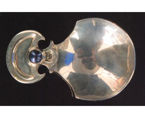 A contemporary hallmarked silver caddy spoon with circular bowl and crescent finial inset with a black pearl, London 2008, Am