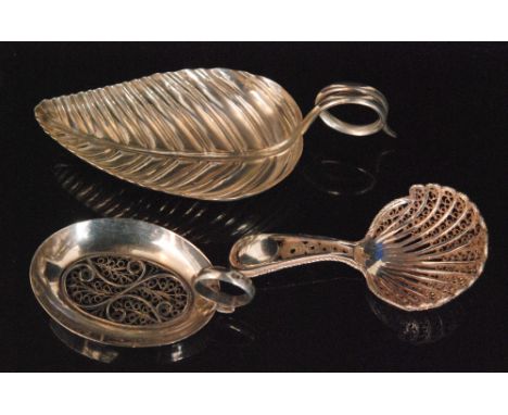 A Georgian silver caddy spoon with a filigree panel insert to the bowl and wirework loop handle Birmingham 1804, Samuel Pembe