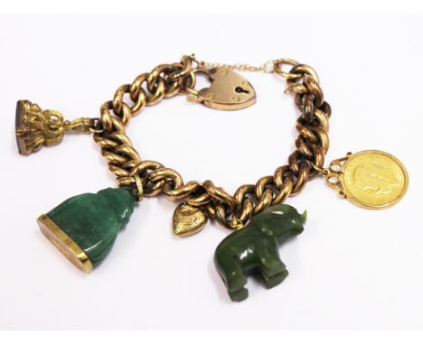A gold coloured charm bracelet the clasp marked 9ct, charms include a 9ct gold mounted half sovereign, a 9ct gold mounted jad
