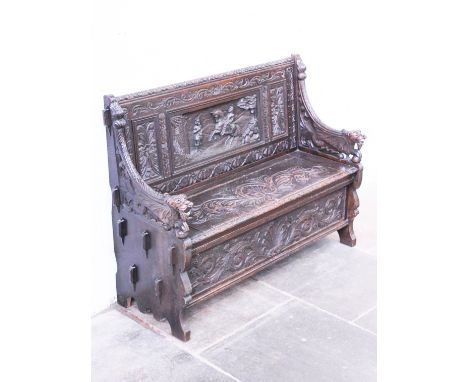 A carved oak bench. Early 20th century. L126cm