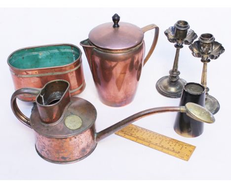 A mixed lot comprising a W.A.S. Benson tea pot, other metalware to include a pair of candle sticks, a watering can and plante