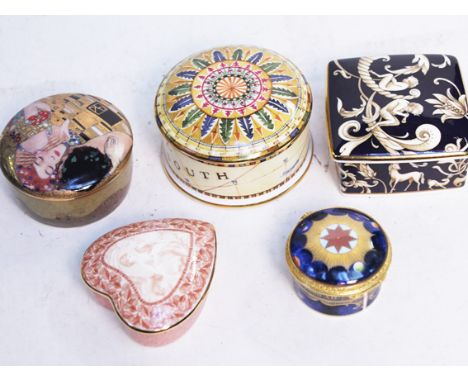 A group of five modern porcelain trinket boxes comprising three Wedgwood, a Royal Worcester and another