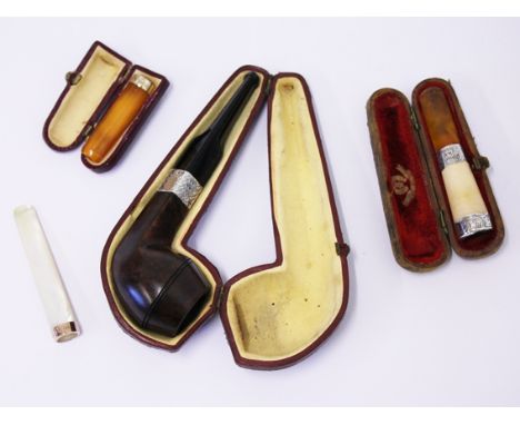 A mixed lot comprising a vintage pipe with silver collar, a silver mounted amber and meerschaum cheroot holder, a 9ct gold mo