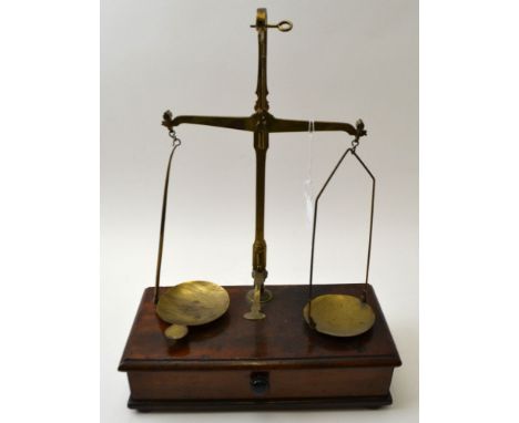 "W &amp; T Avery Ltd" of Birmingham, a brass balance scale, on mahogany box base, fitted drawer contains weights, 26cm wide