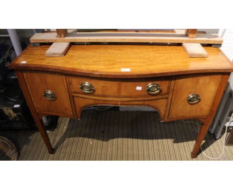 An early 20th century satinwood bow-fronted desk