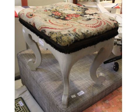 A small white painted stool with tapestry top