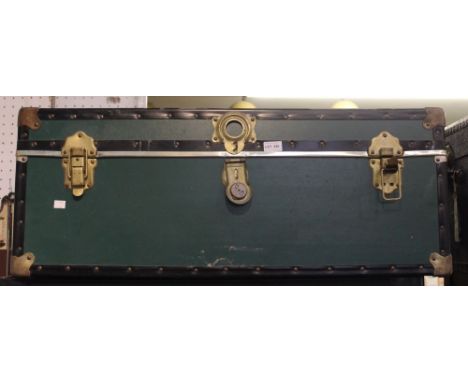 A vintage green travel trunk