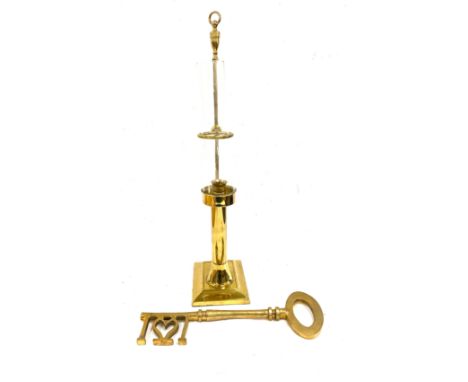 Brass light and a large brass key 