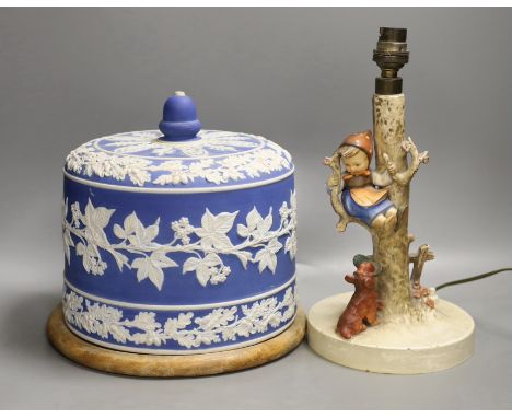 A Victorian blue jasper cheese bell cover, later wood stand, 23 cm high, and a Hummel table lamp