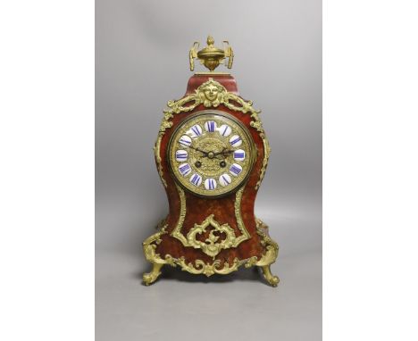 A late 19th century French scarlet tortoiseshell and ormolu mounted mantel clock - 40cm tall