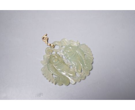 A Chinese carved bowenite jade ‘fish’ pendant,