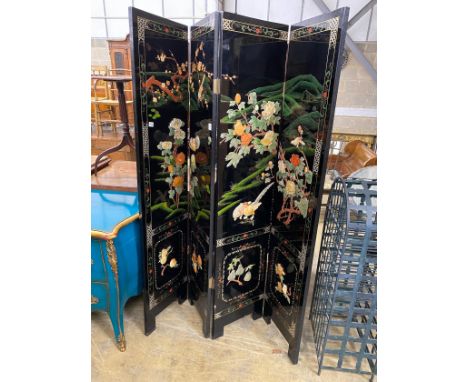 A Chinese black lacquer four fold dressing screen, each panel width 40cm, height 185cm