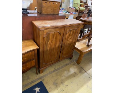 An early 19th century mahogany two door cupboard width 107cm, depth 33cm, height 113cm.