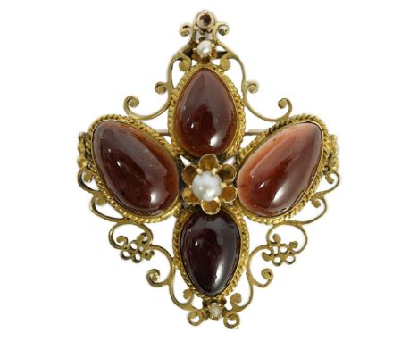 A Victorian gold, four stone garnet and three stone split pearl set mourning pendant brooch, with pear shaped garnets and pie