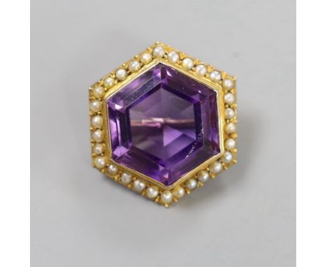 An Edwardian yellow metal, amethyst and seed pearl set hexagonal brooch, 23mm, gross weight 9.1 grams.