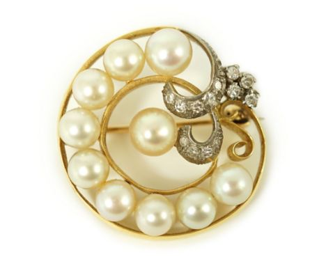 A 20th century gold, cultured pearl and diamond set open work scroll brooch, 29mm, gross weight 11.1 grams.