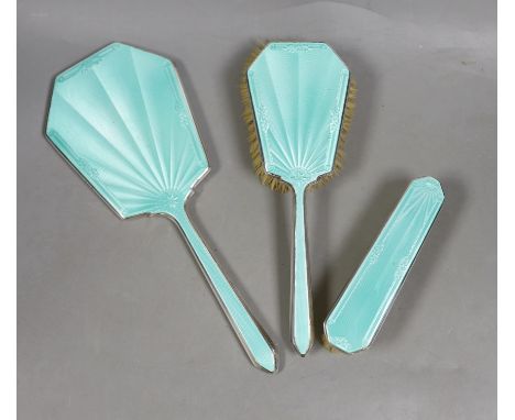 A George VI silver and green guilloche enamel three piece mirror and brush set, Daniel Manufacturing Co. Birmingham, 1938/9, 